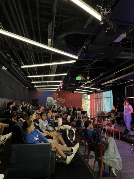 Students fill the room at Dazzle for our Jazz for the Schools program, fall 2024.